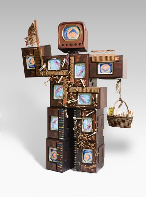 Nam June Paik, John Cage Robot II, 1995, vintage wood television cabinets, color television receivers, DVD players, multi-channel video, piano keys, piano hammers, piano wire, acrylic paint, basket, books, wood mushrooms, and chessmen. 274.3 x 203.2 x 78.7 cm. Crystal Bridges Museum of American Art, Bentonville, Arkansas, 2011.17. Photography by Edward C. Robison III.