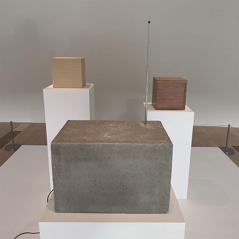(clockwise from back left) Ashley Zelinskie’s Cube with the Sound of its Own Printing (2014/2021), Robert Morris’ Box with the Sound of Its Own Making (1961) and Timm Ulrichs’ Radio (1977/2021).