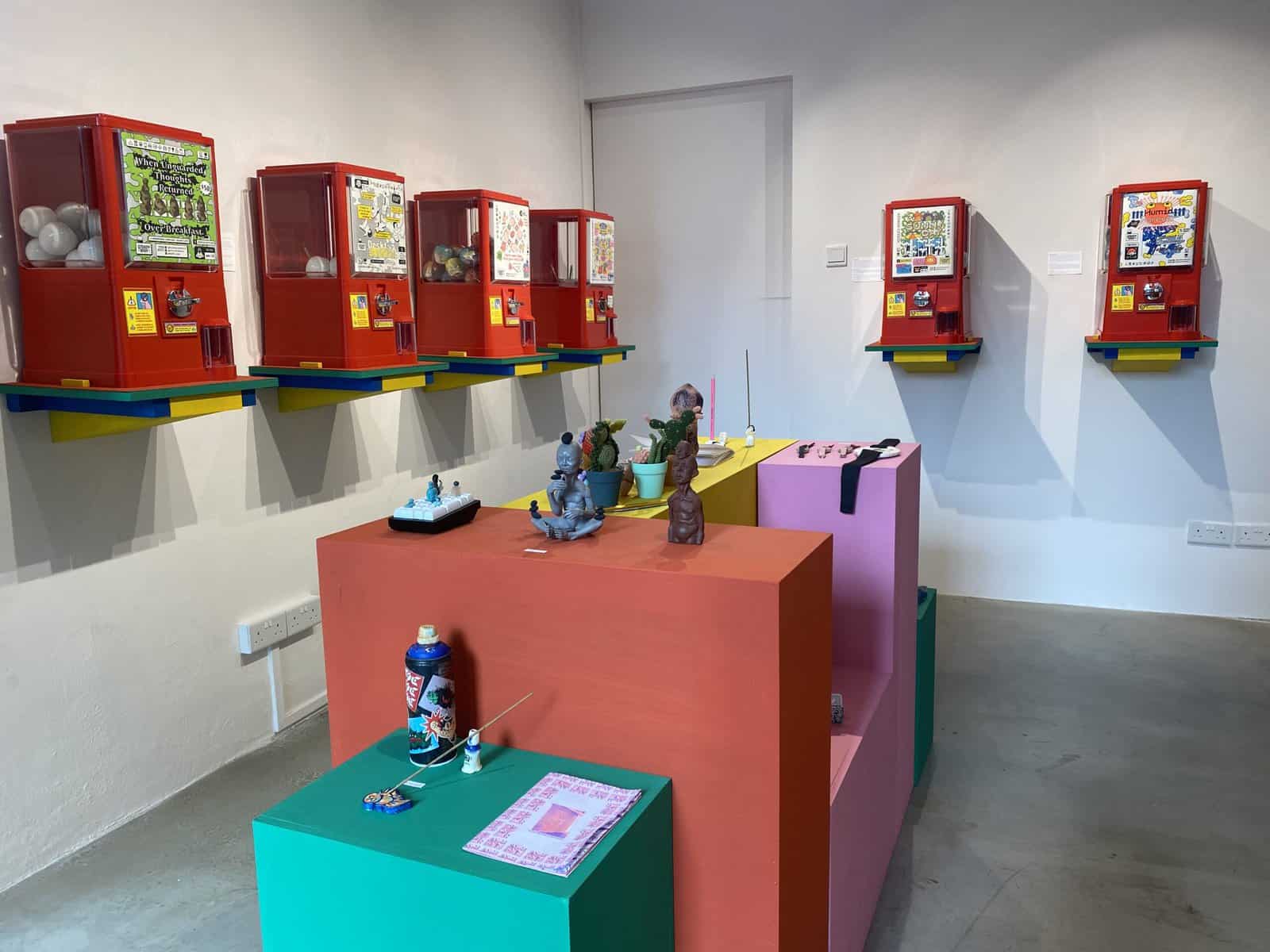 Exhibition view of Let's Play Ball featuring Gachapon capsule vending machines