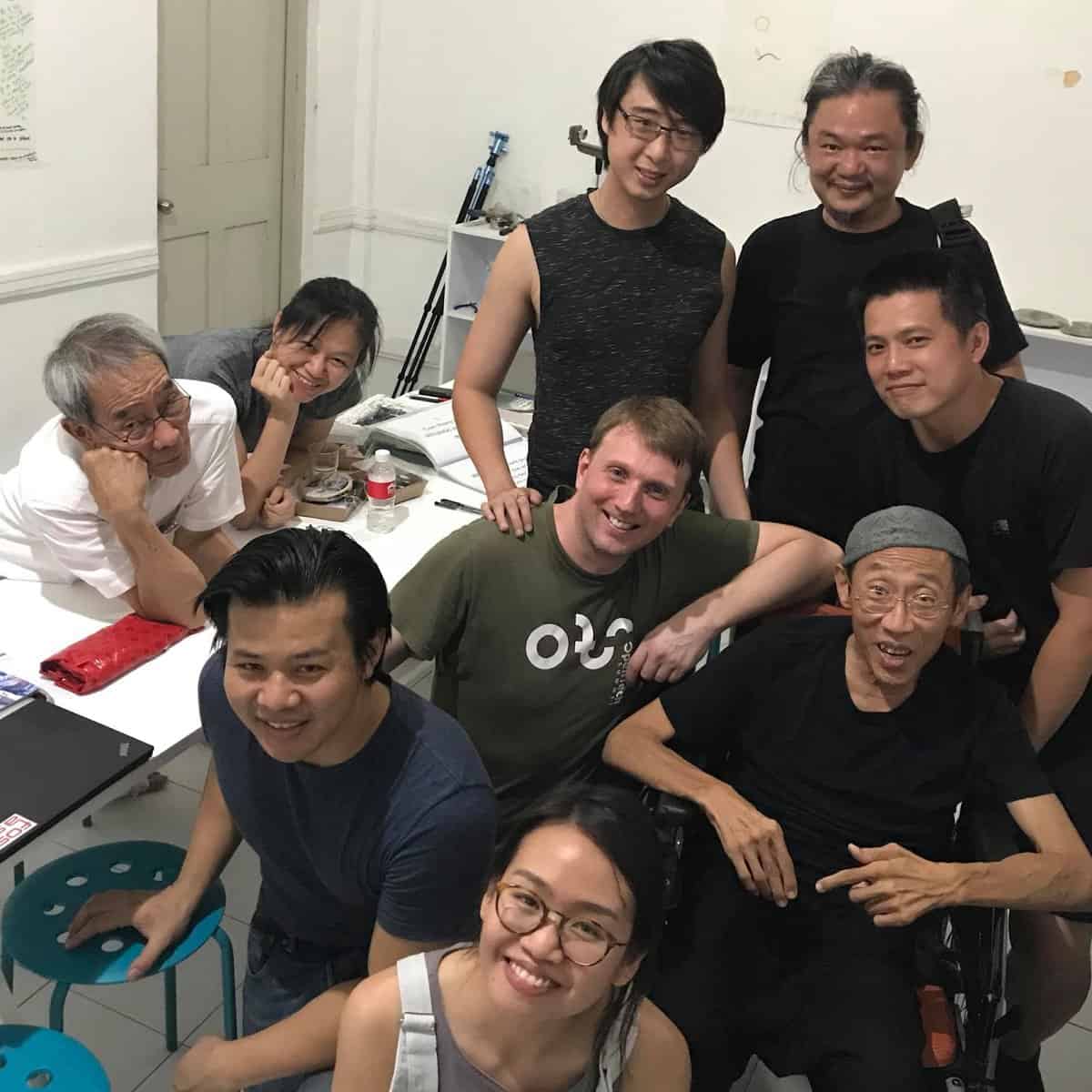 Picture of Koh (centre), Tang (left, in white), Lee (bottom right), Hiah (left of Koh), with the practitioners from The Artists Company, and friends