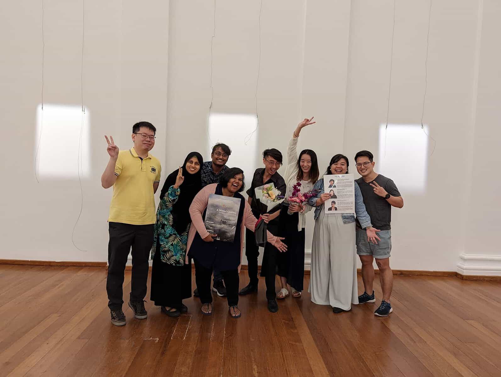Jireh Koh (in the centre, holding a bouquet) with collaborators from VocaSong Ensemble, Solace Art Psychotherapy, and volunteers from the LASALLE College of the Arts MA Art Therapy programme