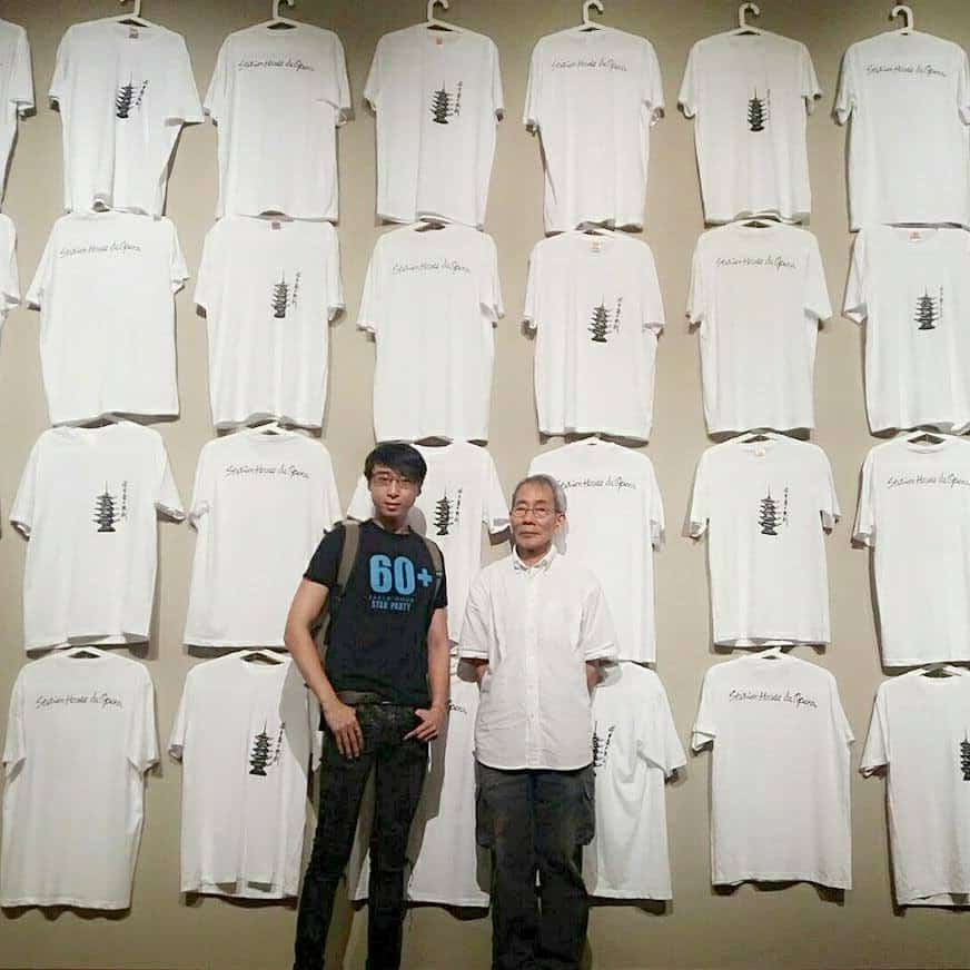 Picture of Jireh Koh and Tang Da Wu, taken against the backdrop of the performers’ t-shirts and when Tang first established Stitchen Haus Da Opera in 2017