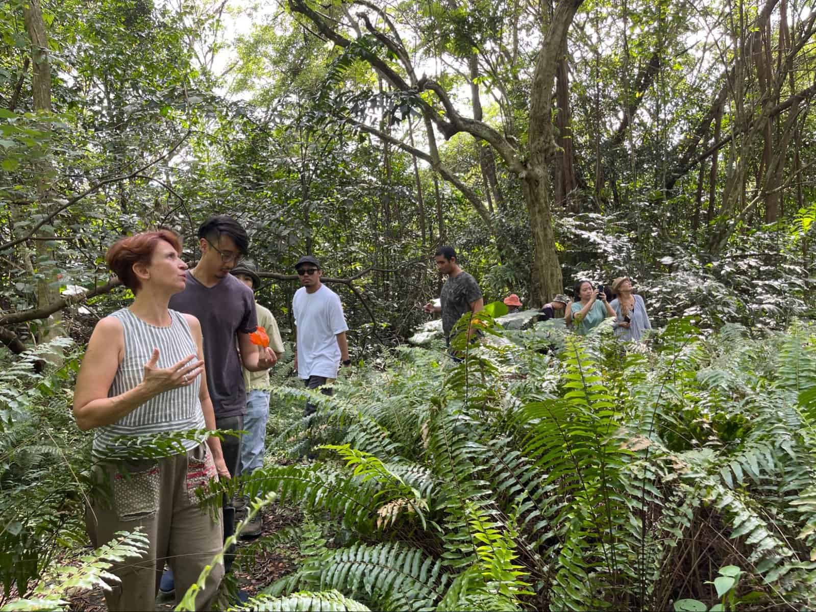 Jireh Koh exploring the landscape around Singapore's Turf Club Road with artist Isabelle Desjeux
