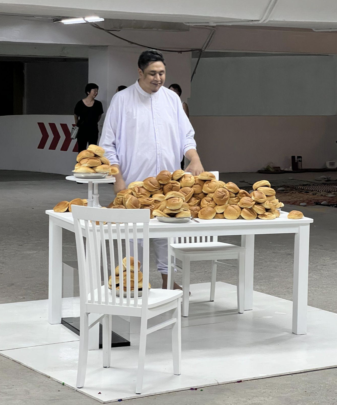 Commissioned artist, Ezzam Rahman activating his site specific installation through a performance